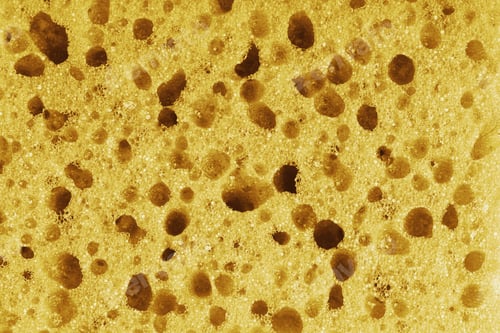 Preview: Macro, Closeup Of Yellow Foam Sponge Texture With Porous, Spongy And Bubbly Pattern Background