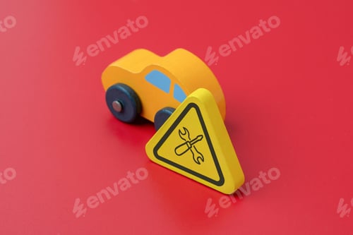 Preview: A yellow car on a red background with a sign displaying a wrench and screwdriver icon.