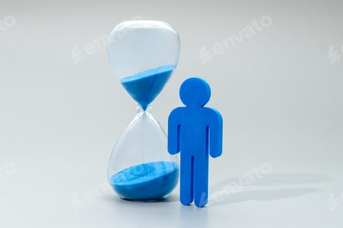 Preview: A blue miniature human figure and hourglass.
