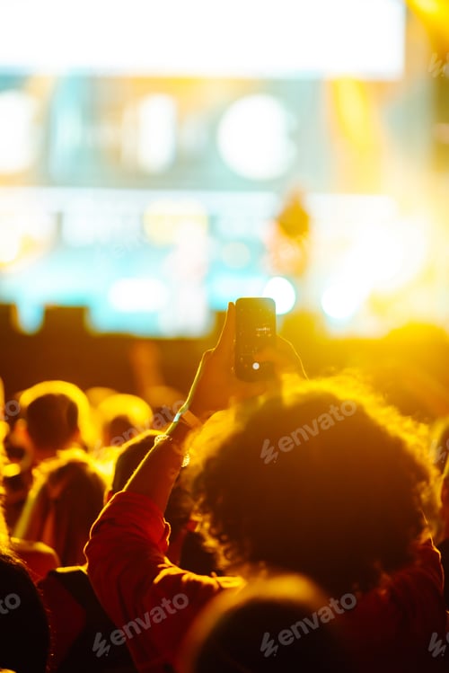 Preview: Hand with smartphone records live music festival, Taking photo of concert stage, live concert.
