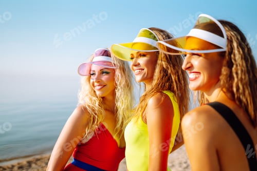 Preview: Young dancers in colorful swimsuits are dancing in morning. ?oncept of sports, fitness Active sport.