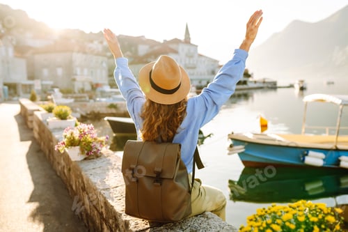 Preview: Young female tourist enjoys view of the city. Europe travel. Vacation, tourism, nature, active life.
