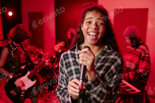 Preview: Portrait of Biracial Teenage Singer Performing with Girls Music Group