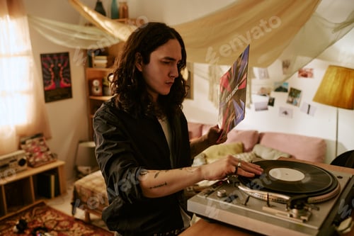 Preview: Young Man Playing Vinyl Records at Home for Music Lifestyle Content
