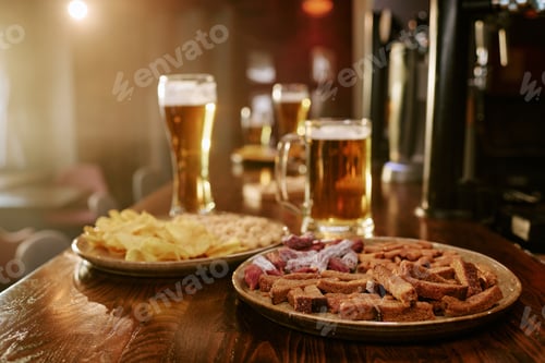 Preview: Beer Glasses with Bar Snacks Served for Casual Social Dining