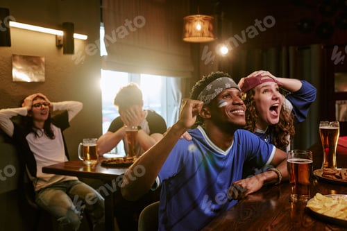 Preview: Diverse Friends Cheering While Watching Sports in Bar for Fan Marketing