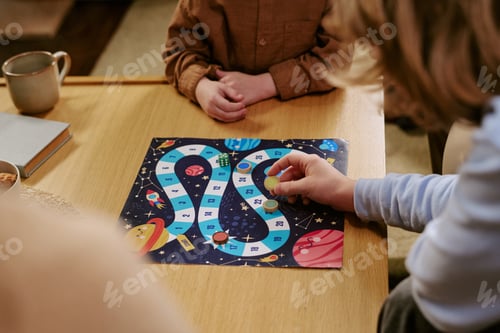 Preview: Children Playing Space Board Game at Home for Family Learning