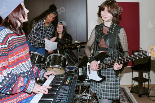 Preview: Teenage Girls Rehearsing in Music Studio for Band Promotion