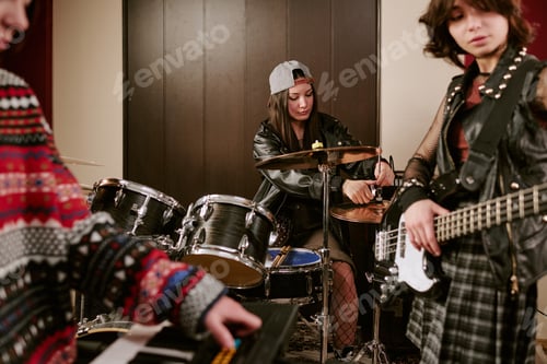 Preview: Teenage Girls Tuning Instruments during Band Practice Session