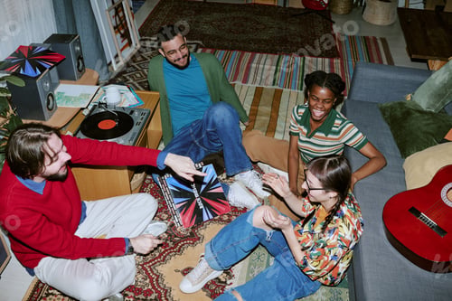 Preview: Diverse Friends Listening to Vinyl Records during Home Gathering