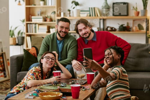 Preview: Multiethnic Adult Friends Taking Selfie during Game Night at Home