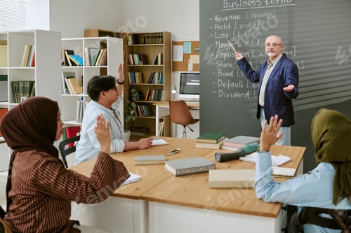 Preview: Migrant Students Learning Business English in Classroom with Teacher