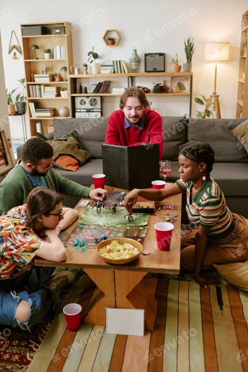 Preview: Diverse Adult Friends Playing Tabletop Game during Social Gathering