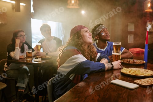 Preview: Diverse Friends Watching Sports in Bar for Fan Engagement Campaign