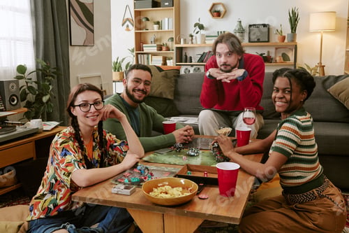 Preview: Portrait of Diverse Friends Playing Board Game during House Party