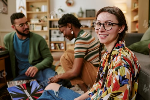 Preview: Portrait of Adult Woman Socializing with Friends at Home