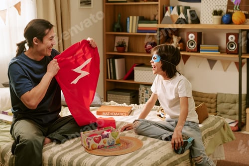 Preview: Father and Son Playing Superhero Game at Home for Family Bonding