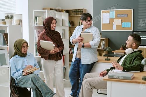 Preview: Multiethnic College Students Discussing Books in Language Class