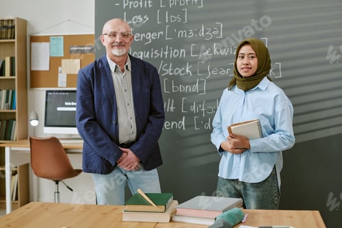 Preview: Portrait of Migrant Student Student Learning with Male Teacher