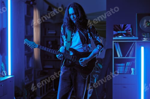 Preview: Man Showcasing Guitar Skills at Home for Music Promotion