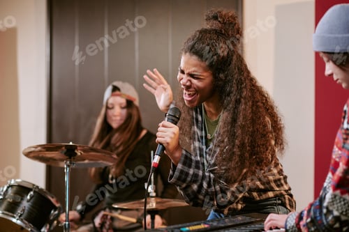 Preview: Teenage Girls Performing Live Music during Band Rehearsal