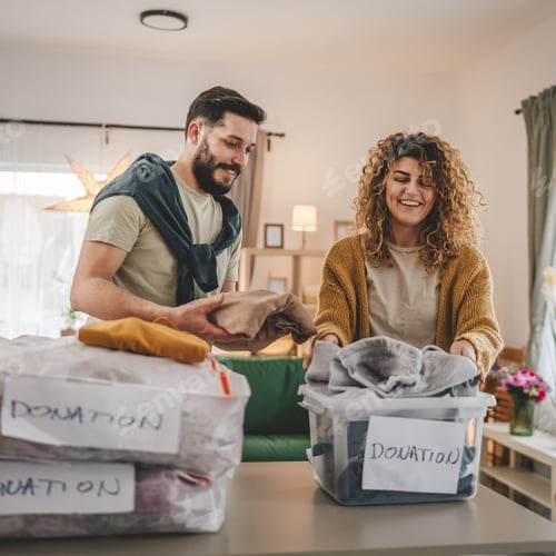 Preview: Couple Stand at Home Choose Clothes for Donation Sorting Wardrobe