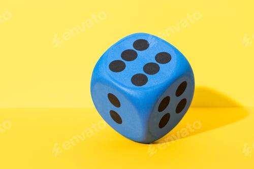 Preview: Blue Dice Showing Number Six on Yellow Background