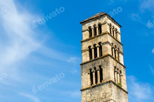 Preview: Low angle view of historical St Luke bell tower and medieval church stone walls in Jajce, Bosnia and