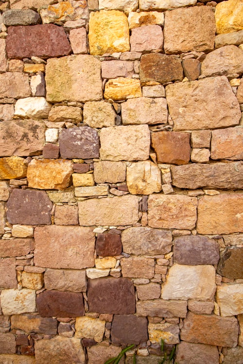 Preview: Rustic old stone wall texture with brown and yellow bricks in historical building