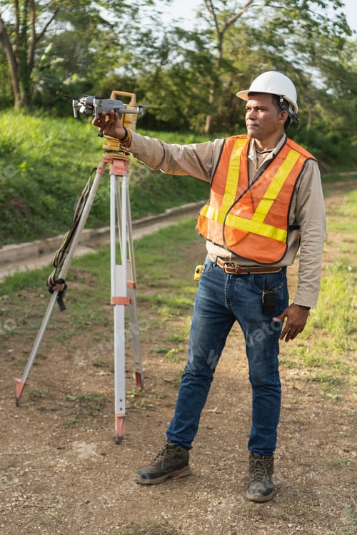 Preview: Surveyor worker holding drone for topographical mapping