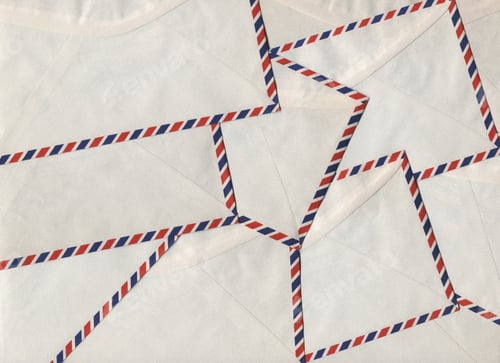 Preview: Vintage airmail envelopes arranged in a repeating pattern forming a textured postal paper background