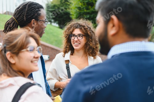 Preview: Diverse young adults enjoying conversation outdoors