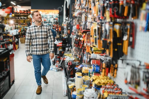 Preview: Portrait of mature man standing in hardware store