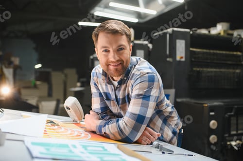 Preview: Male technician working in a printing factory