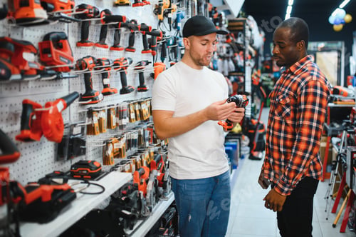 Preview: A sales consultant helps a client choose a screwdriver in a hardware store