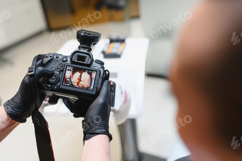 Preview: Dentist using camera for professional intraoral diagnostic photography