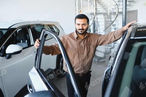 Preview: Man posing with open car doors at dealership