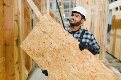 Preview: Construction of modular houses. Indian construction worker or engineer at construction site