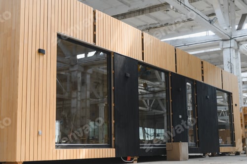 Preview: A new wooden modular prefabricated house inside in manufacturing facility