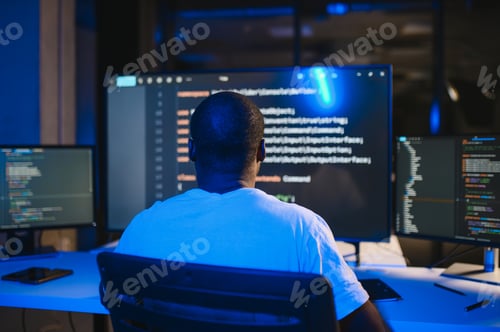 Preview: African american IT Programmer Working on Desktop Computer.