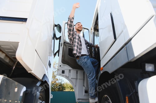 Preview: Happy truck driver waving from semi truck cab