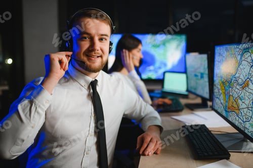Preview: Dispatch operative smiling in call center late night