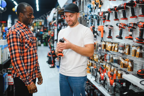 Preview: Buying a drill or screwdriver. A consultant in a hardware store advises a male customer on the purch