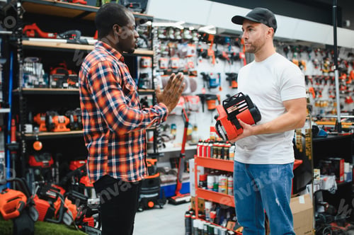 Preview: A sales consultant helps a client choose an electric saw in a hardware store