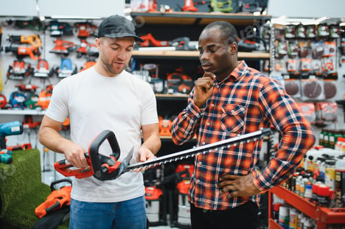 Preview: The sales consultant helps the client chooses a brushcutter in a hardware store