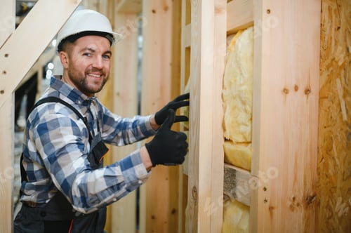 Preview: Portrait of a carpenter smiling with crossed arms in a lumber warehouse, showcasing expertise in the
