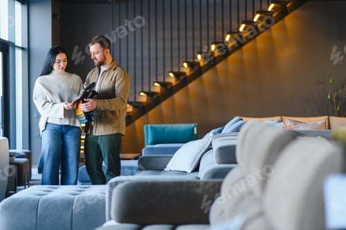 Preview: Couple choosing fabric samples for new home furniture