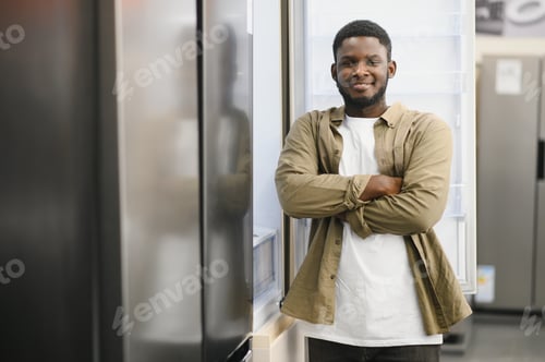 Preview: Man choosing fridge in the shop