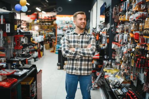 Preview: Young man working in hardware store