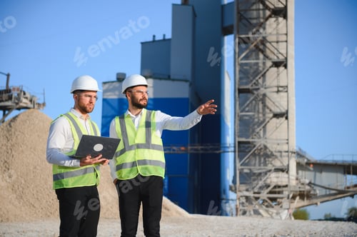 Preview: Two engineers at a stone crushing plant. The concept of quarrying.